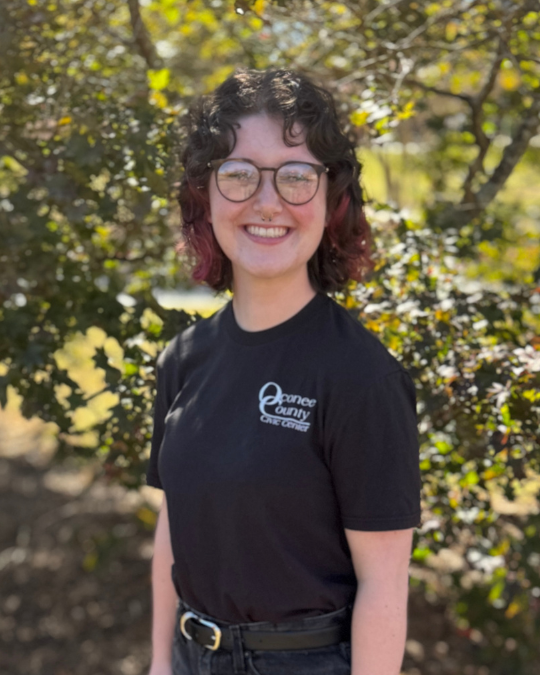 Headshot of smiling event assistant, Carsun Neubauer.