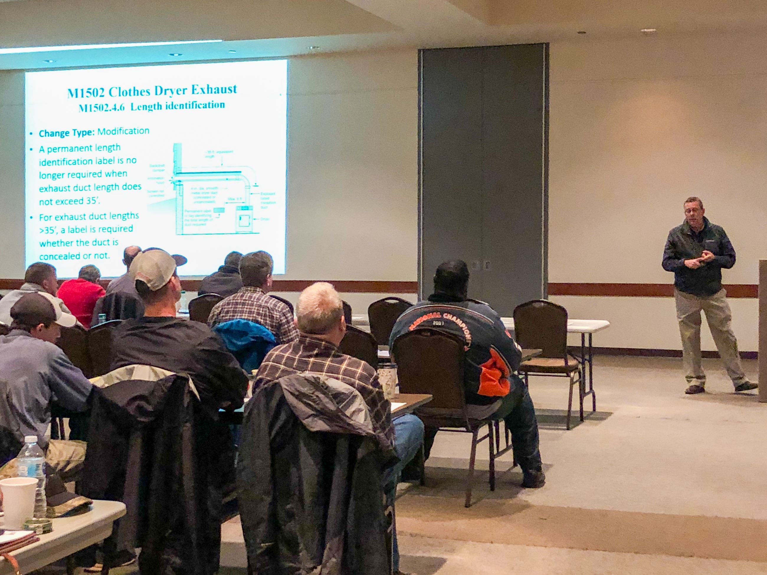 Attendees at Builder and Contractor Class Listen to a Presentation